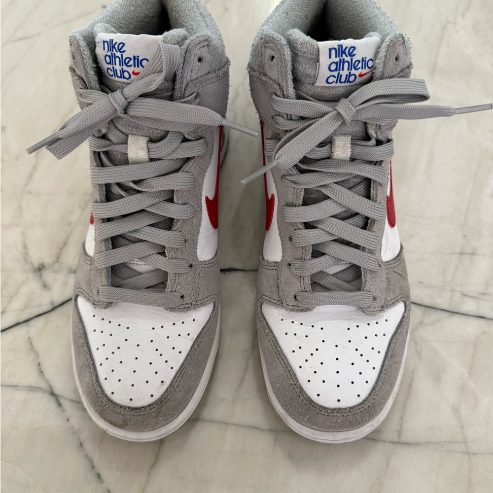Nike Gray and White dunks with Red Swoosh